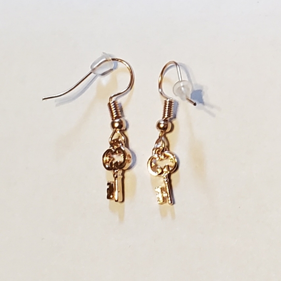 Paparazzi gold key earrings.